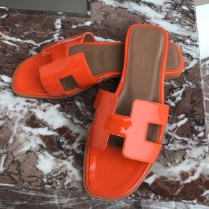 Hermes Oran Slide Sandals In Orange Patent Calfskin