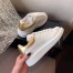 Alexander McQueen Women's Oversized Sneakers With Gold Heel