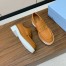 Prada Women's Loafers in Brown Grained Leather 