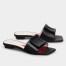 Roger Vivier Covered Buckle Mules in Black Leather